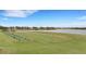 Driving range with multiple hitting stations and a lake at 4727 Motta Ct, Bradenton, FL 34211
