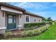 Front door view with teal-colored double door and brick walkway at 4727 Motta Ct, Bradenton, FL 34211