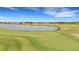 Golf course green with a lake in background at 4727 Motta Ct, Bradenton, FL 34211
