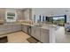 Modern kitchen with stainless steel appliances and light gray cabinets at 4727 Motta Ct, Bradenton, FL 34211