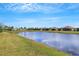 Scenic view of lake with homes in background at 4727 Motta Ct, Bradenton, FL 34211