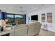 Living room with large sectional sofa, sliding glass doors, and patio access at 4727 Motta Ct, Bradenton, FL 34211