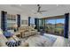 Spacious living room featuring recessed lighting, a ceiling fan, and access to a patio at 4727 Motta Ct, Bradenton, FL 34211