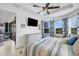 Bright bedroom with a king-size bed and access to a sitting area at 4727 Motta Ct, Bradenton, FL 34211