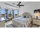 Relaxing main bedroom with large windows, a king-size bed, and ceiling fan at 4727 Motta Ct, Bradenton, FL 34211