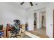 Home office with desk, chair, and view into adjacent bedroom and bath at 4727 Motta Ct, Bradenton, FL 34211