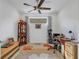 Home office with wooden desk and chair, and decorative display cabinet at 4727 Motta Ct, Bradenton, FL 34211