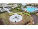 Community pool with lounge chairs and fire pit at 4727 Motta Ct, Bradenton, FL 34211
