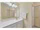 Clean bathroom with white vanity, large mirror, and updated fixtures at 504 Spring Lakes Blvd # 504, Bradenton, FL 34210