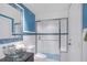 Clean bathroom with blue accents and a glass shower at 507 Casey Key Rd, Nokomis, FL 34275