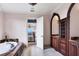Luxurious bathroom with a large tub and double vanity at 507 Casey Key Rd, Nokomis, FL 34275