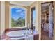 Luxurious bathroom with soaking tub, walk-in shower, and marble finishes at 507 Casey Key Rd, Nokomis, FL 34275
