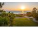 Scenic beach view with sunset and ocean at 507 Casey Key Rd, Nokomis, FL 34275