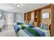Basement bedroom with three twin beds and built-in shelving at 507 Casey Key Rd, Nokomis, FL 34275