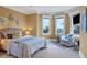 Spacious bedroom with bay windows, comfortable seating, and stylish decor at 507 Casey Key Rd, Nokomis, FL 34275