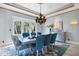 Formal dining room featuring a large table and ocean view at 507 Casey Key Rd, Nokomis, FL 34275