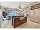 Open kitchen with large island and breakfast area at 507 Casey Key Rd, Nokomis, FL 34275