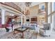 Open living room with grand staircase and fireplace at 507 Casey Key Rd, Nokomis, FL 34275