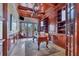 Home office with built-in shelving and hardwood floors at 507 Casey Key Rd, Nokomis, FL 34275