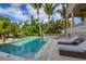 Inviting pool and spa with lounge chairs at 507 Casey Key Rd, Nokomis, FL 34275