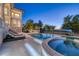 Luxury pool and spa area with ocean view at 507 Casey Key Rd, Nokomis, FL 34275