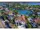 Aerial view of waterfront home with canal access and pool at 508 Siesta Dr, Sarasota, FL 34242