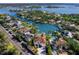 Bird's-eye view of waterfront home and community, highlighting the canal and surrounding area at 508 Siesta Dr, Sarasota, FL 34242