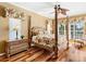 Spacious bedroom with wood floors and water views at 508 Siesta Dr, Sarasota, FL 34242
