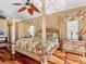 Main bedroom with a large four poster bed at 508 Siesta Dr, Sarasota, FL 34242