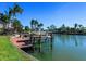 Private boat dock with covered lift and waterfront access at 508 Siesta Dr, Sarasota, FL 34242