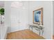 Bright entryway with double doors, hardwood floors, and an elegant console table at 508 Siesta Dr, Sarasota, FL 34242