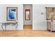 Elegant hallway with hardwood floors and art at 508 Siesta Dr, Sarasota, FL 34242