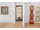 Hallway with access to the in-home elevator with decorative elements at 508 Siesta Dr, Sarasota, FL 34242