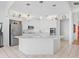Modern kitchen with white cabinetry, stainless steel appliances, and an island at 508 Siesta Dr, Sarasota, FL 34242