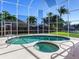 Relaxing kidney-shaped pool and spa, perfect for outdoor entertaining at 508 Siesta Dr, Sarasota, FL 34242