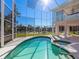 Inviting pool and spa with screened enclosure overlooking the canal at 508 Siesta Dr, Sarasota, FL 34242