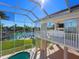 Enclosed pool and patio area with canal views at 508 Siesta Dr, Sarasota, FL 34242