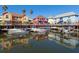Colorful waterfront homes and boats in marina setting at 508 Siesta Dr, Sarasota, FL 34242
