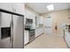 Community kitchen with stainless steel appliances and white cabinets at 5248 Bouchard Cir # 201, Sarasota, FL 34238