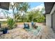 Relaxing backyard patio with seating area and lush landscaping at 525 Hillside S Dr, St Petersburg, FL 33705