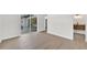 Spacious bedroom with hardwood floors and sliding glass doors to the patio at 525 Hillside S Dr, St Petersburg, FL 33705