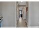 Bright hallway with neutral colored walls and tiled floors at 5311 Tidewater Preserve Blvd, Bradenton, FL 34208