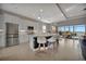 Modern kitchen with white cabinets, stainless steel appliances, and large island at 5311 Tidewater Preserve Blvd, Bradenton, FL 34208