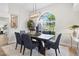 Elegant dining room with dark wood table and six blue chairs at 5538 61St E St, Bradenton, FL 34203