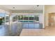 Sunroom with pool and patio access at 5833 Fairwoods Cir, Sarasota, FL 34243