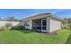 Screened patio and lush green lawn at 5862 Guarino Dr, Sarasota, FL 34238