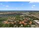 Elevated aerial view of community location with nearby ocean views and waterway at 607 Marcus St # 27, Venice, FL 34285