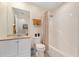 Full bathroom featuring a shower/tub combo, white vanity, and neutral decor at 607 Marcus St # 27, Venice, FL 34285