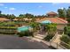Inviting community pool with a clubhouse, lounge area, and lush landscaping at 607 Marcus St # 27, Venice, FL 34285