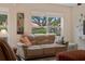 Inviting living area with plush sofa, large windows, and decorative accents at 607 Marcus St # 27, Venice, FL 34285